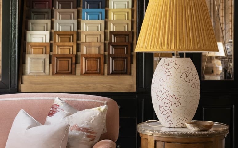 Bespoke interior with armchair, lamp and wood finish samples