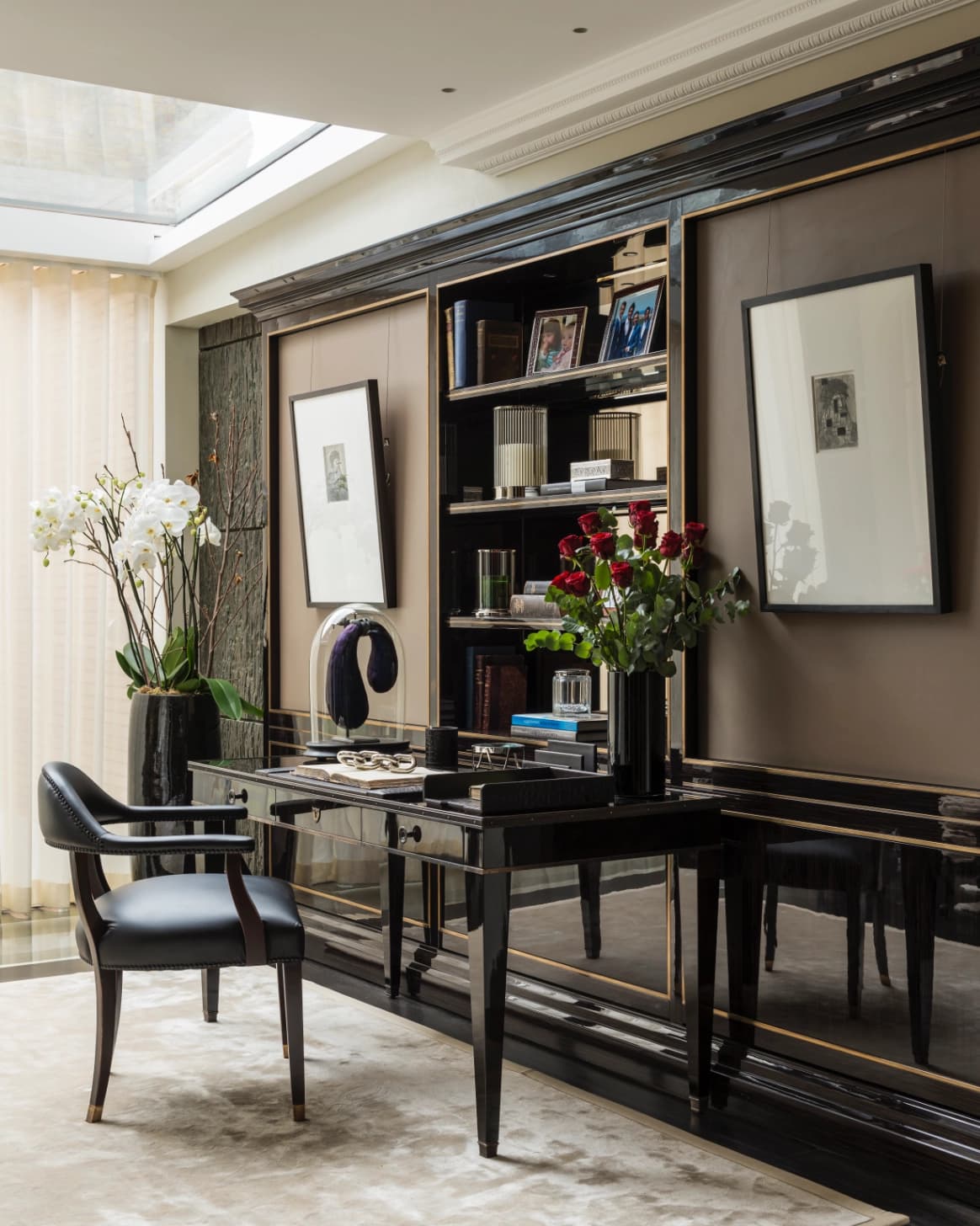 Bespoke home office with black lacquer desk and built-in shelving